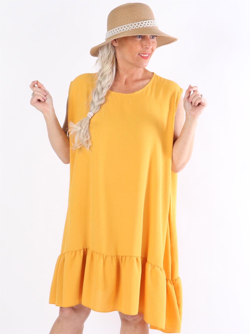 Manola - Kjole i løs pasform med flæsekant forneden